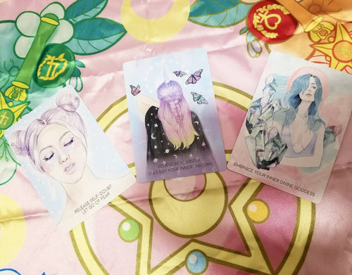 oracle cards on a pink background