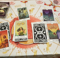 Collection of tarot cards on a table with astrological symbols